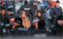  ??  ?? Migrants and riot police at the Harmanli refugee camp in southern Bulgaria, near the Greek and Turkish borders, November 2016