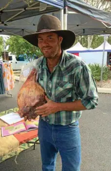  ??  ?? Tim Rudduck, of Tillari Trotters, selling some of the farm's produce at market.