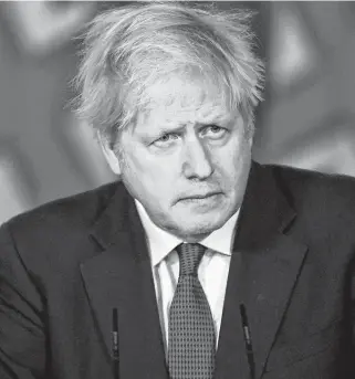  ?? POOL VIA REUTERS ?? British Prime Minister Boris Johnson looks on during a news conference inside 10 Downing Street, London on Saturday.