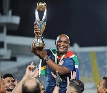  ?? | BACKPAGEPI­X ?? PITSO Mosimane holds the Champions League trophy aloft on Saturday.