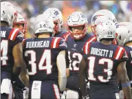  ?? Winslow Townson / Associated Press ?? New England Patriots quarterbac­k Tom Brady in the huddle against the Cleveland Browns.