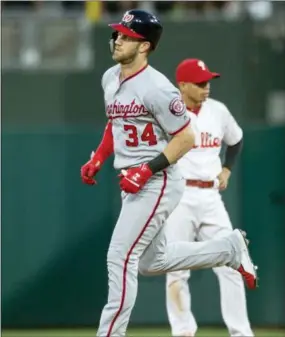  ?? LAURENCE KESTERSON — THE ASSOCIATED PRESS ?? The Nationals’ Bryce Harper (34) rounds the bases after hitting a three-run home run in the fourth inning Friday against the Phillies. The Phillies lost, 17-7.