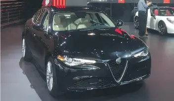  ?? PHOTOS: DALE EDWARD JOHNSON ?? The Alfa Romeo Giulia features a triangle front grill that sets its styling apart.