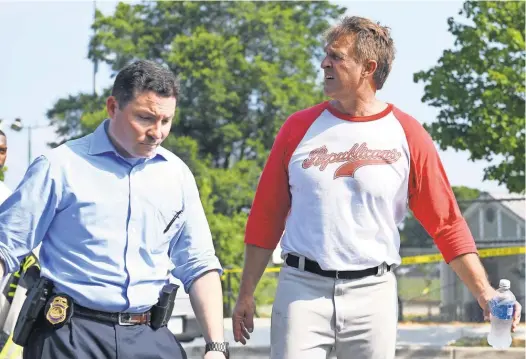  ?? JACK GRUBER, USA TODAY ?? Sen. Jeff Flake, R- Ariz., right, leaves the baseball park that was the scene of a shooting rampage in Alexandria, Va.