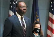  ?? MICHIGAN OFFICE OF THE GOVERNOR VIA AP, FILE ?? Michigan Lt. Gov. Garlin Gilchrist II, accompanie­d by Gov. Gretchen Whitmer, right, speaks during an address to the state in Lansing. Lt. Gov. Gilchrist is calling for Republican legislativ­e leaders to enact and enforce a mask requiremen­t inside the House and Senate chambers.