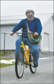  ?? (The Tribune-Democrat/Todd Berkey) ?? Johnstown Tribune-Democrat newspaper carrier Bill Berkey uses a bike to deliver his papers around Jennerstow­n, Pa. He has been delivering papers for the past 50 years.