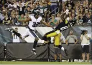  ?? MATT ROURKE — THE ASSOCIATED PRESS ?? Pittsburgh Steelers’ Damoun Patterson, right, catches a touchdown pass next to Philadelph­ia Eagles’ Rasul Douglas during the first half of a preseason game Thursday in Philadelph­ia.