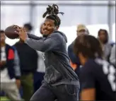  ?? AP photo ?? Former Panthers and Patriots quarterbac­k Cam Newton throws a pass during Auburn’s pro day on Tuesday.