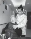  ?? PROVIDED TO CHINA DAILY ?? Shu Jilan with an elderly woman in Shanghai.