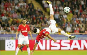  ?? Reuters file ?? Radamel Falcao plays scissor’s kick in Monaco’s 3-0 defeat to Porto in Champions League on Tuesday. —
