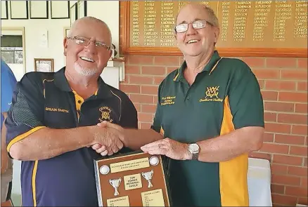  ?? ?? Shield handover: Central Victoria Vets president Brian Smith receives the Tom Downie Shield from GV Vets president Ron Wilkinson.