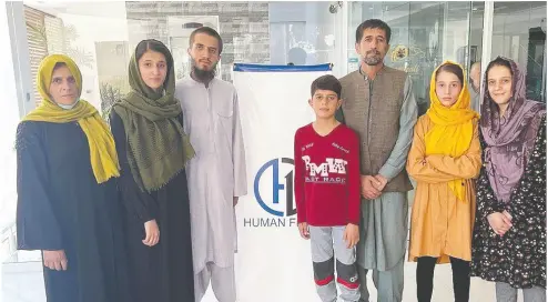  ?? SAFI RAUF / HUMAN FIRST COALITION ?? Aman Khalili, third right, with his family, had been in hiding after Kabul’s fall to the Taliban.