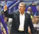  ?? Stephen Dunn / Associated Press ?? UConn coach Geno Auriemma directs his team against Seton Hall on Saturday in Hartford.