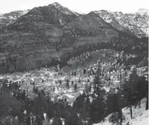  ?? [AP PHOTO/NATHAN BILOW] ?? The old mining town of Ouray, Colorado, is nestled 7,700 feet above sea level on the doorstep of Red Mountain Pass. Ouray is virtually ringed by 14,000-foot-peaks in the San Juan Mountains of southwest Colorado.