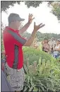  ??  ?? Horticultu­rist Andy Pulte tells his audience why they might want to add a pineapple lily (lower right) to their gardens.