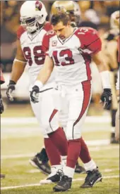  ?? Ronald Martinez
Getty Images ?? KURT WARNER of the Cardinals is dazed during a divisional playoff loss to the Saints on Jan. 16, 2010.