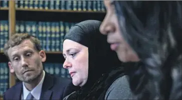  ?? Irfan Khan Los Angeles Times ?? “I AM SEEKING justice because I do still have the right to be a covered Muslim woman — even in jail,” Jennifer Hyatt of Newbury Park, above at a news conference Tuesday, said in a statement. She was detained in 2017.