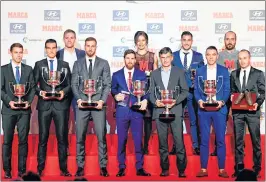  ??  ?? Barcelona's Argentinia­n forward Lionel Messi (C) with the rest of award winners after receiving the Alfredo di Estefano award for the 2017 leading goal scorer 'Pichichi' of the Spanish league, in Barcelona.