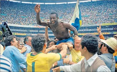  ??  ?? Pele on shoulders of teammates as Brazil win the World Cup final against Italy in Mexico, 1970