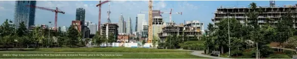  ??  ?? Athletes village being constructe­d in the West Don Lands area, downtown Toronto, prior to the Pan American Games