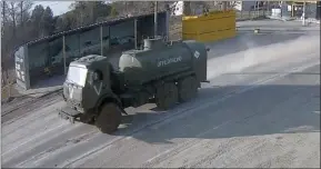  ?? The Associated Press ?? A frame grab taken by the battery-operated camera placed by Chernobyl Tour to show the company’s tourist informatio­n centre near the Chernobyl nuclear power plant, shows Russian military vehicles rolling into Chernobyl, the site of the world’s worst nuclear disaster, on the second day of the war, in the village of Dytyatki, Ukraine, Feb. 25.