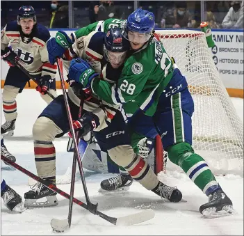  ?? STEVEN MAH/SOUTHWEST BOOSTER ?? Swift Current Broncos defenseman Sam Mcginley (right) wasn’t giving Lethbridge’s Alex Thacker any room to operate in front of the Broncos goal during a 2-1 win on Feb. 5.