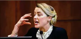  ?? Jim Lo Scalzo / Associated Press ?? Actress Amber Heard testifies in the courtroom at the Fairfax County Circuit Court in Fairfax, Va., on Thursday. Actor Johnny Depp sued his ex-wife actor Amber Heard for libel.