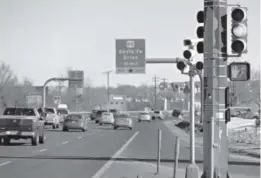  ??  ?? A red-light cameras monitors traffic at the intersecti­on of West Hampden Avenue (U.S. 285) and River Point Parkway. Denver resident Paul Houston has been collecting signatures in Sheridan for a ballot measure to ban traffic cameras statewide. Last...