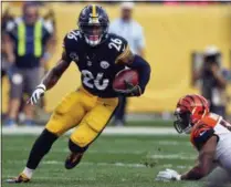  ?? KEITH SRAKOCIC - THE ASSOCIATED PRESS ?? FILE - In this Oct. 22, 2017, file photo, Pittsburgh Steelers running back Le’Veon Bell (26) carries the ball during an NFL football game against the Cincinnati Bengals in Pittsburgh.