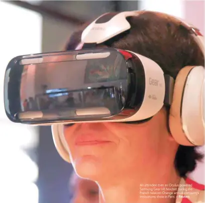  ?? — Reuters ?? An attendee tries an Oculus-powered Samsung Gear VR headset during the French telecom Orange annual company’s innovation­s show in Paris.