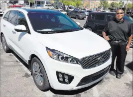  ??  ?? Findlay Kia Findlay Kia sales consultant Darnell Ray shows off a 2018 Kia Sorento SXL at the dealership at 5325 W. Sahara Ave.