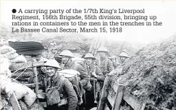  ??  ?? A carrying party of the 1/7th King’s Liverpool Regiment, 156th Brigade, 55th division, bringing up rations in containers to the men in the trenches in the La Bassee Canal Sector, March 15, 1918