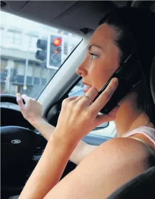  ?? PICTURE POSED BY MODEL ?? Operation Tramline will be cracking down on driving offences such as using a mobile phone at the wheel