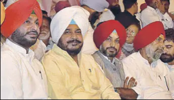  ?? GURPREET SINGH/HT ?? (From left) MP Ravneet Bittu and state minister Sadhu Singh Dharamsot with other Congress leaders during the party’s annual conference at Chhapar village in Ludhiana on Monday.