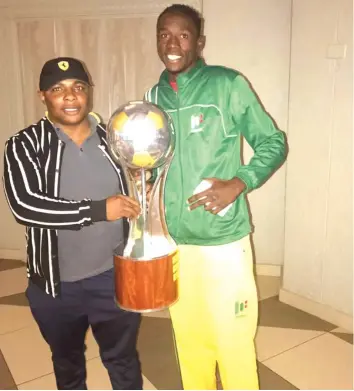  ??  ?? Liberty Chakoroma (pictured here with his manager, James ' Hwetu' Meya) was one of the players the Warriors badly missed against Namibia at National Sports Stadium last Sunday