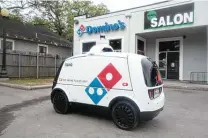  ?? Domino's, Nuro ?? Autonomous robots will be delivering Domino’s pizzas through a new partnershi­p between the pizza chain and Nuro.