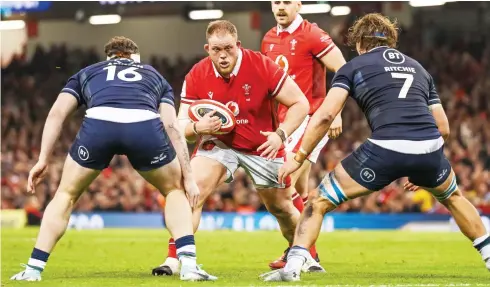  ?? PICTURES: Getty Images ?? Power move: Corey Domachowsk­i in action for Wales agasint Scotland