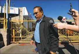  ?? Gary Coronado Los Angeles Times ?? THEN-MAYWOOD MAYOR Ramon Medina is asked questions by reporters in 2018. Last month, he and 10 others were charged with a variety of crimes.