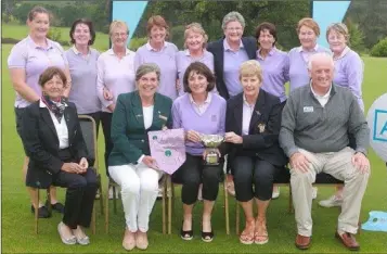  ??  ?? Wexford’s Minor Cup team being presented with the Mid Leinster A.I.G. Ladies’ Minor Cup. Back (from left): Deirdre Colfer, Mary Fallon, Una Robinson, Osnat Manning, Breda Devoy, Marie Byrne (lady President), Therese Glasheen, Maisie Purcell, Denise...