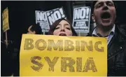  ?? JEWEL SAMAD / AFP / GETTY IMAGES ?? Protesters demonstrat­e outside Trump Tower in New York City on Friday. Prior to the launch of missile strikes by U.S. President Donald Trump, Internet conspiracy theorists were urging the president to stay out of Syria.