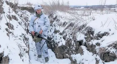  ?? ALEXEI ALEXANDROV/AP ?? A soldier stands in a trench in territory controlled by pro-Russian militants Tuesday in Slavyanose­rbsk, Ukraine.