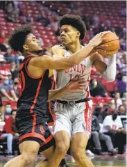  ?? ETHAN MILLER GETTY IMAGES ?? Keith Dinwiddie Jr. and the Aztecs will host David Muoka and the Rebels on Jan. 24 at Viejas Arena.