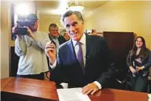  ?? AP ?? Mitt Romney smiles as he declares his candidacy for the US Senate at the state elections office, at the Utah State Capitol, in Salt Lake City.