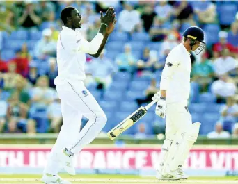  ?? FILE PHOTOS ?? West Indies Jason Holder celebrates after taking the wicket of England’s Tom Westley during day three of the second cricket Test match at Headingley, Leeds, England, Sunday, August 27, 2017.