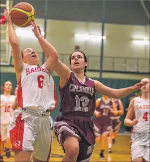  ?? JASON MALLOY/THE GUARDIAN ?? Charlottet­own Rural Raiders guard Maddie Hurley, left, is fouled by Colonel Gray Colonels guard Francis Alvarez Tuesday during the Prince Edward Island School Athletic Associatio­n Domino’s senior AAA girls’ basketball final at UPEI.