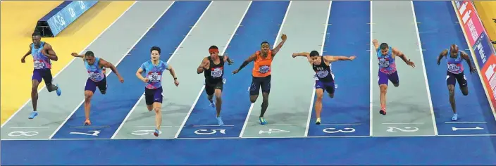  ?? LEE SMITH / ACTION IMAGES VIA REUTERS ?? China's Su Bingtian (third left) wins the 60m final at the Glasgow Indoor Grand Prix at Emirates Arena, Glasgow, on Sunday. It was Su’s fourth indoor victory of the year at the distance as he finished first overall in the point standings for the event...