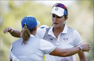  ?? CHARLIE NEIBERGALL — THE ASSOCIATED PRESS ?? The United States’ Lexi Thompson, right, celebrates with teammate Cristie Kerr after winning their four-ball match in the Solheim Cup golf tournament, Saturday in West Des Moines, Iowa.