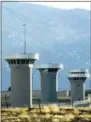  ?? CHRIS MCLEAN—ASSOCIATED PRES ?? In this Feb. 21, 2007, file photo, guard towers loom over the administra­tive maximum security federal prison called Supermax near Florence, Colo.