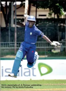  ??  ?? Devin Jayasinghe of S.thomas’ celebratin­g his century. Pic by Amila Prabodha