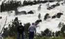  ?? Photograph: Lukas Coch/AAP ?? Locals take a look at overflow water spills from Wyangala Damn near the NSW town of Cowra, Monday, November 15, 2021.